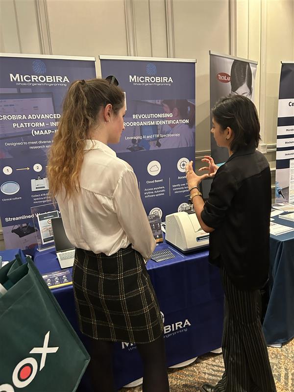 Microbira talking to a delegate at the WMA conference